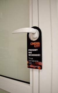 An informational hanger CINEMACITY manufactured with the use of the technique of digital UV printing